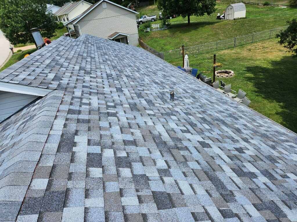 Completed roof replacement — OC shingles aerial view